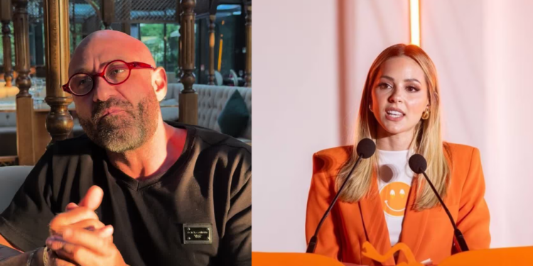 Pedro-ferriz-cuestiono-a-mariana-rodriguez - Entre Regios Left: Bald Man with Red Glasses Wearing a Black Shirt, Hands Clasped; Right: Woman in an Orange Blazer Speaking at a Two-mic Podium. - Entre Regios